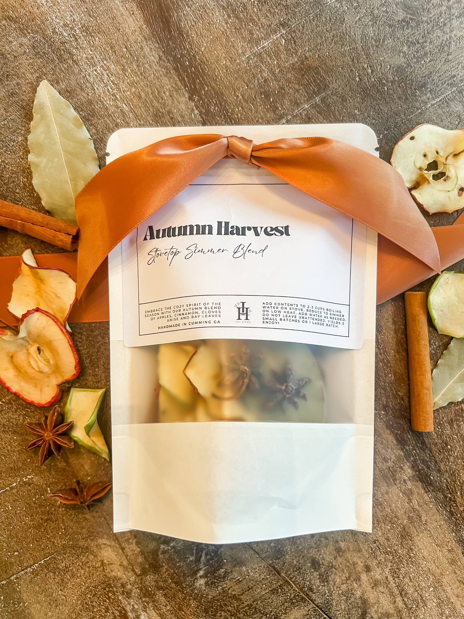 A fall simmer pot blend with dried apples, cinnamon sticks, cloves, anise, and bay leaves for a warm, spiced autumn scent.
