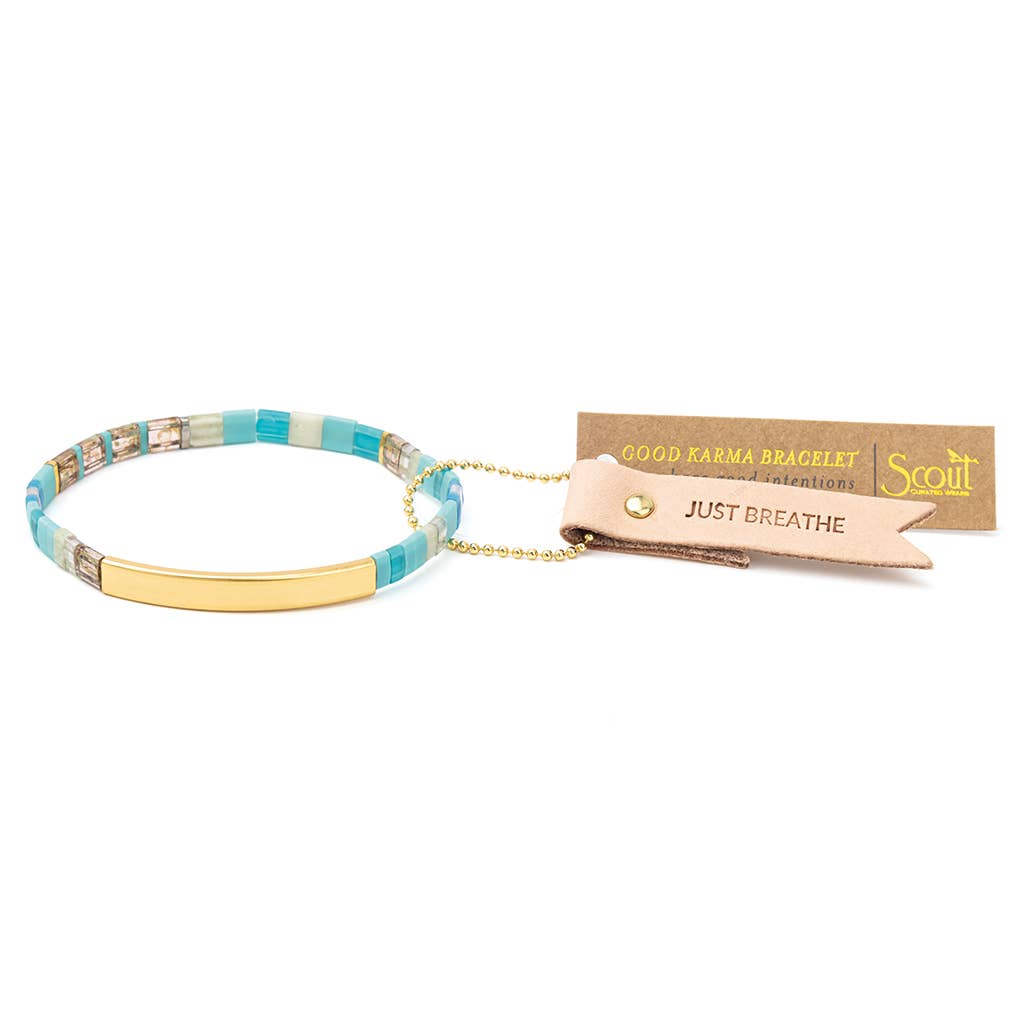 Good Karma bracelet with 'Just Breathe' tag on a white background