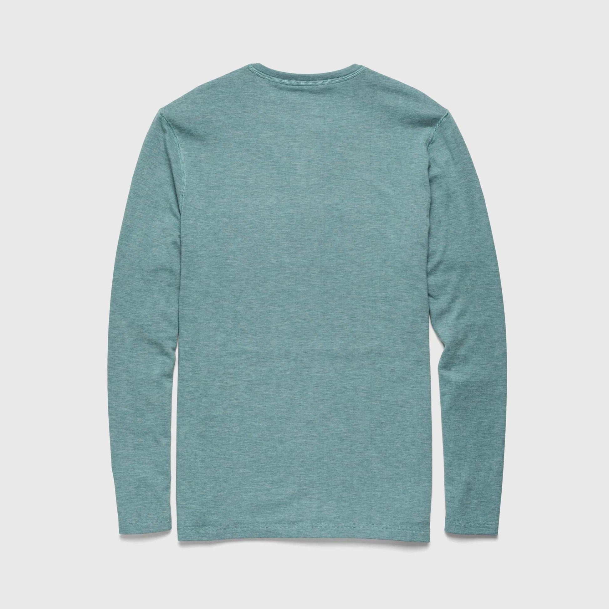 Teal long-sleeve shirt on a light gray background