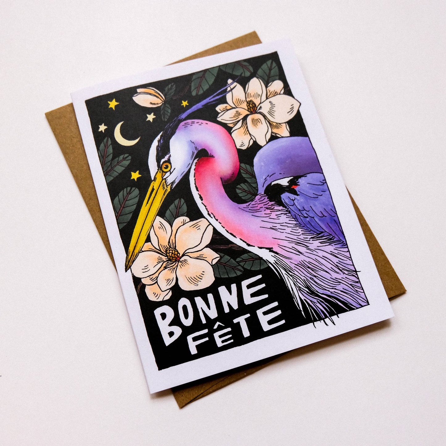 Greeting card with a colorful heron illustration and 'Bonne Fète' text on a white background