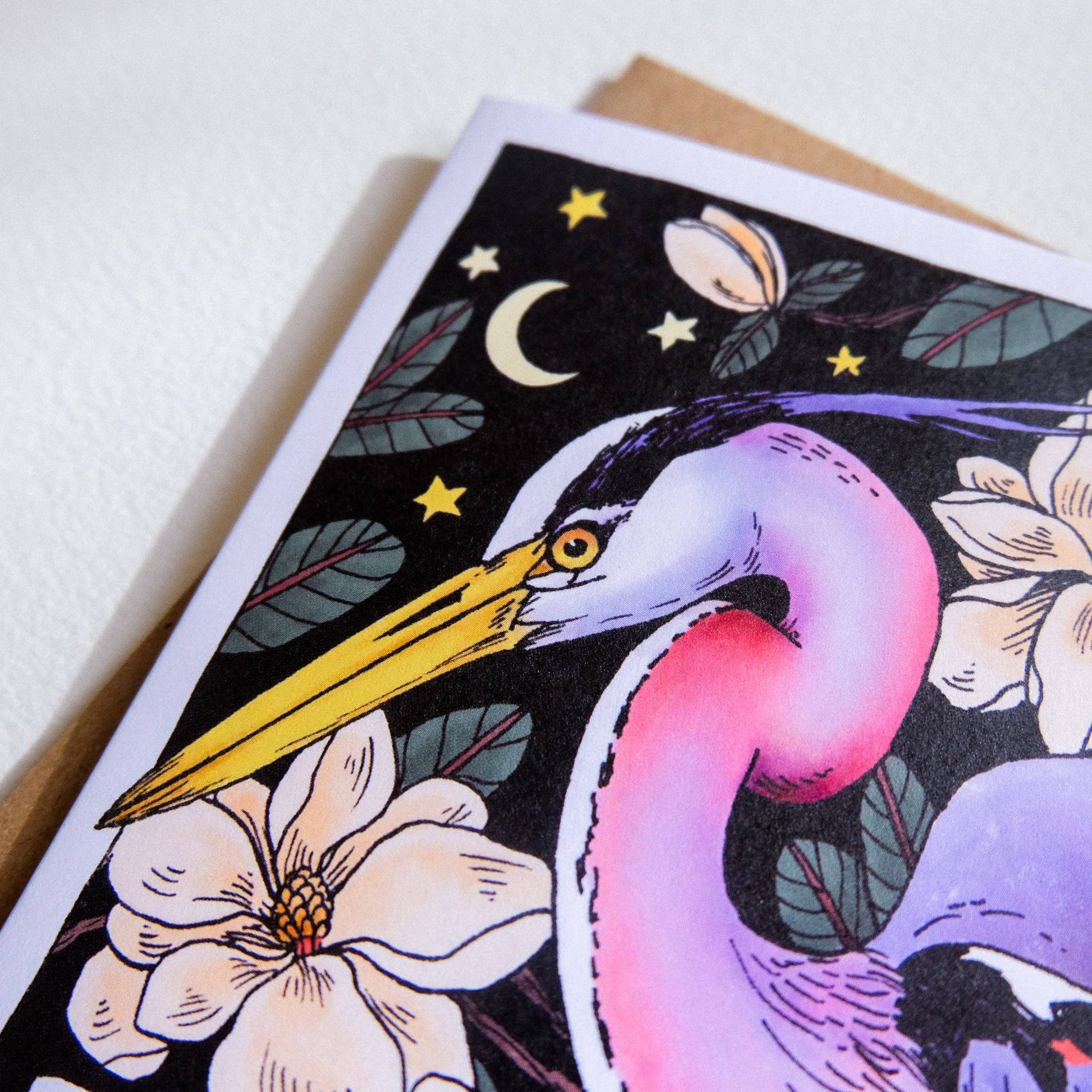 Greeting card with a stylized heron and floral design on a white background