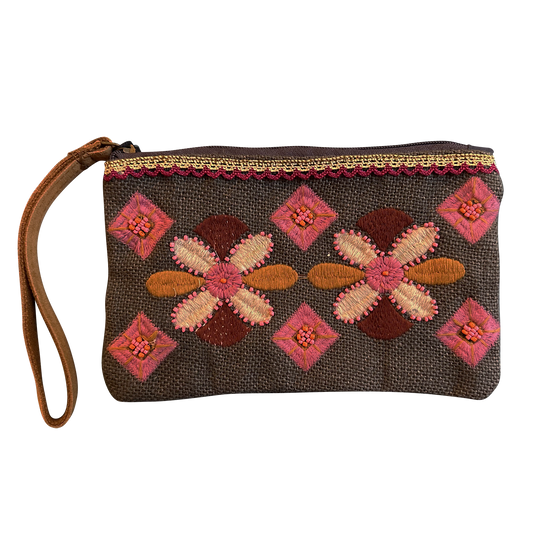 Embroidered clutch bag with floral patterns on a white background