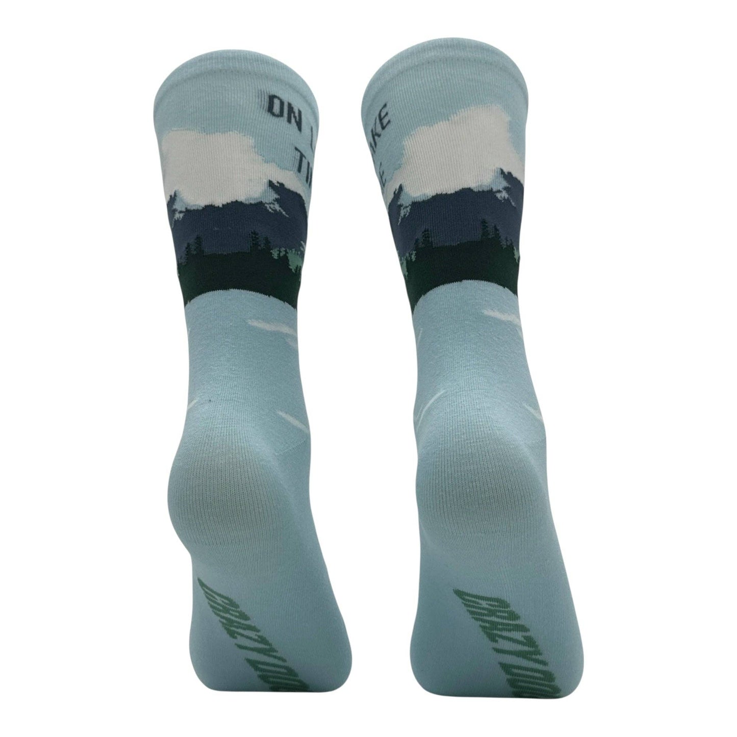 Pair of socks with nature design and text on a white background