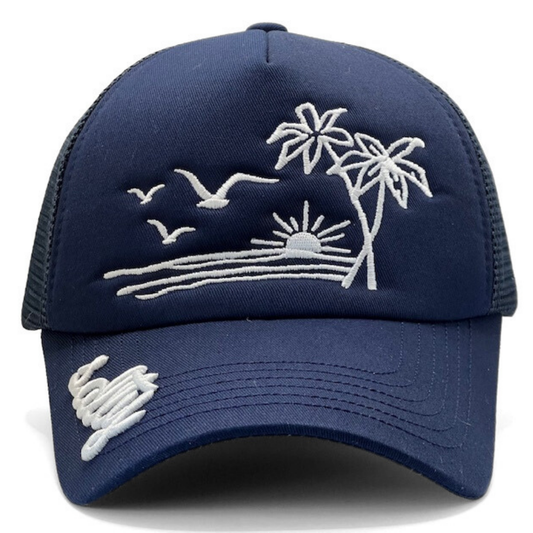 Navy blue cap with white embroidered design of palm trees, birds, and a sun on a white background