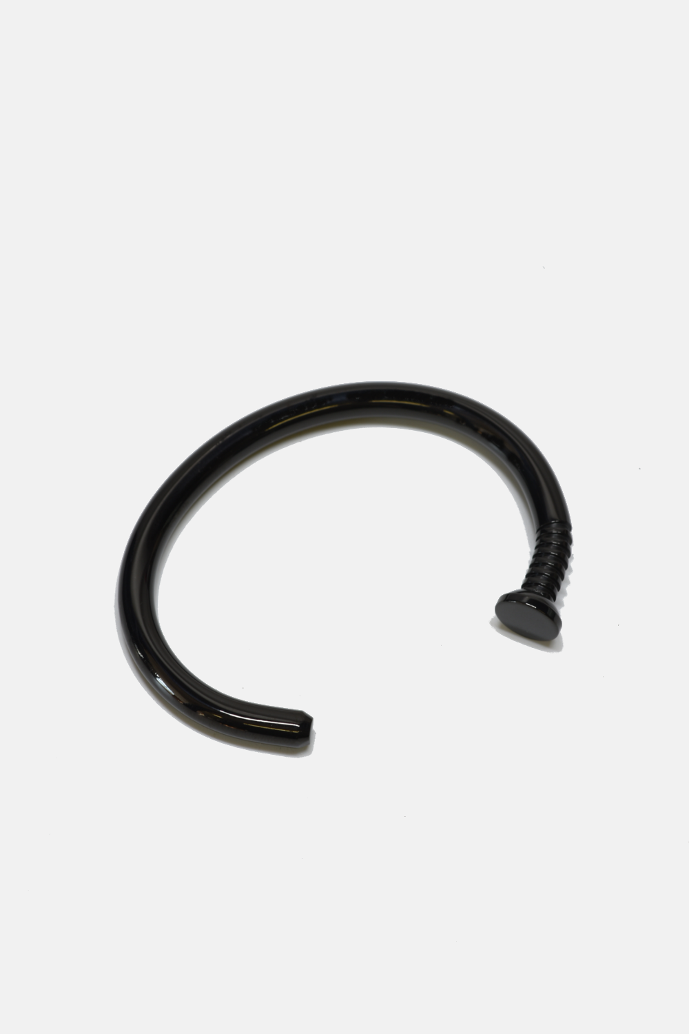 Black nail cuff on a white background