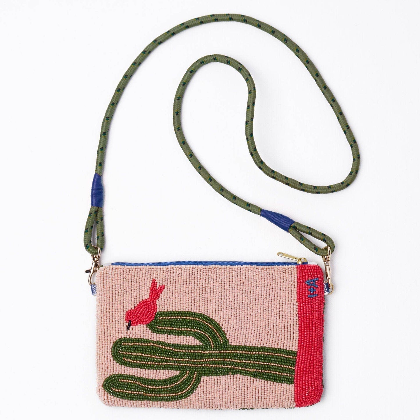 Handbag with cactus and bird design on a white background