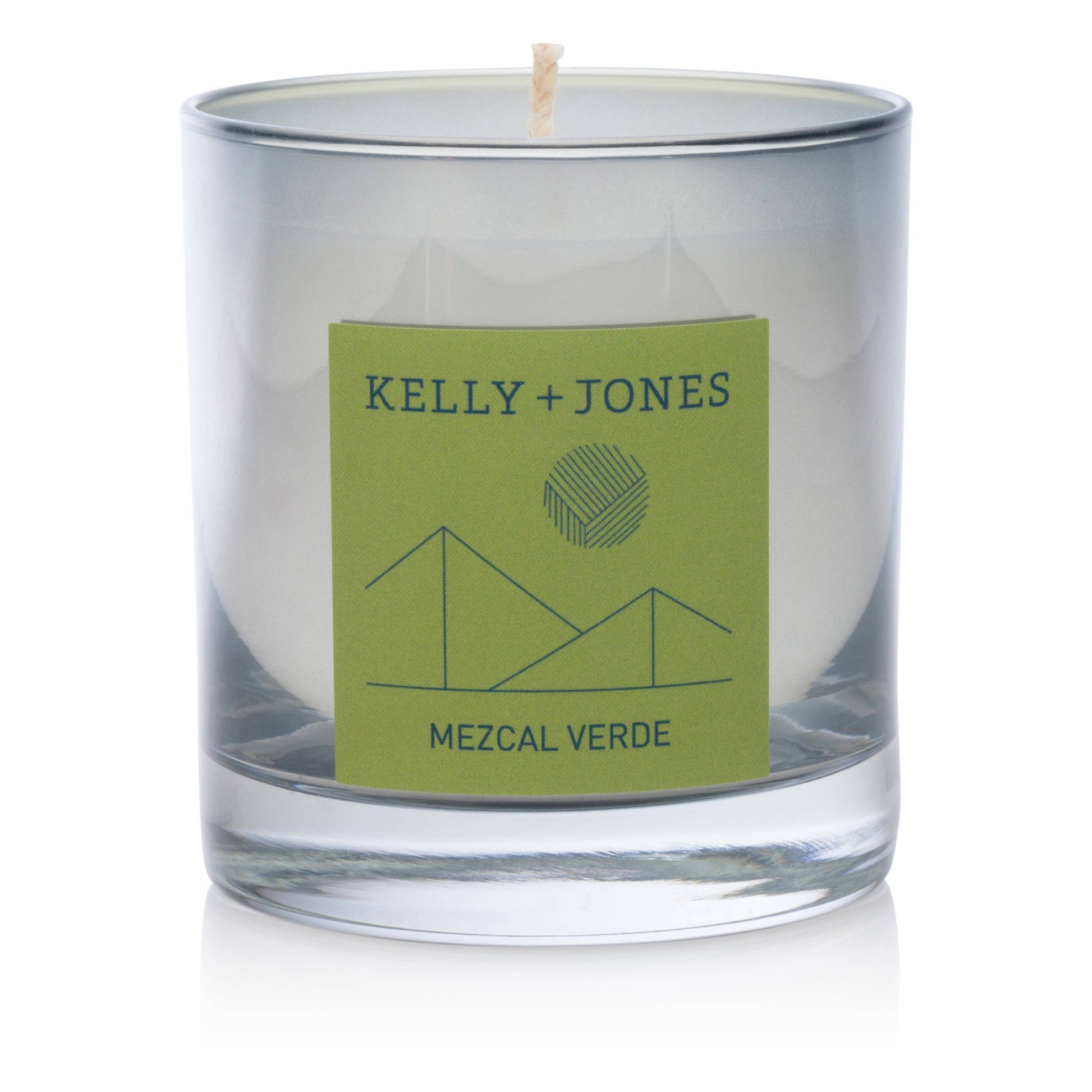 Glass candle with a green label featuring 'Kelly + Jones' and 'Mezcal Verde' on a white background