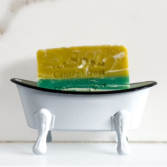 Bar of soap on a white stand with 'Center Street Soap Co' branding.
