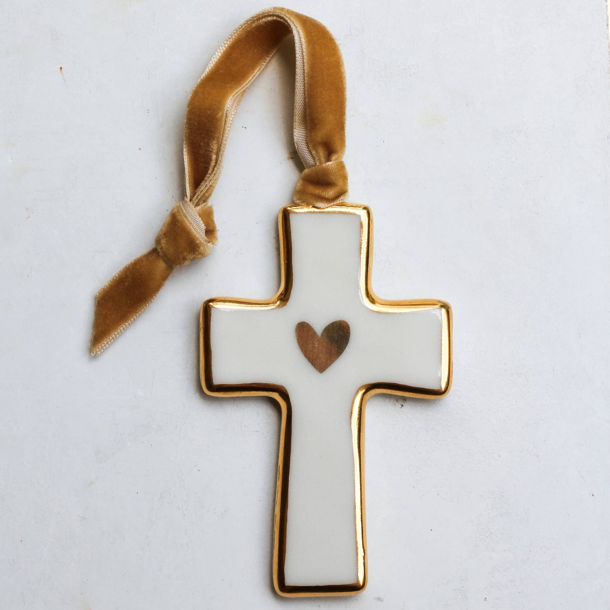Decorative cross with a heart on a white background