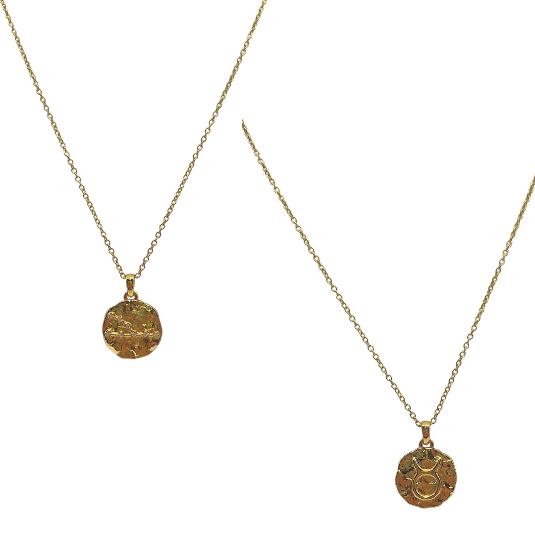 Two gold necklaces with circular pendants on a white background