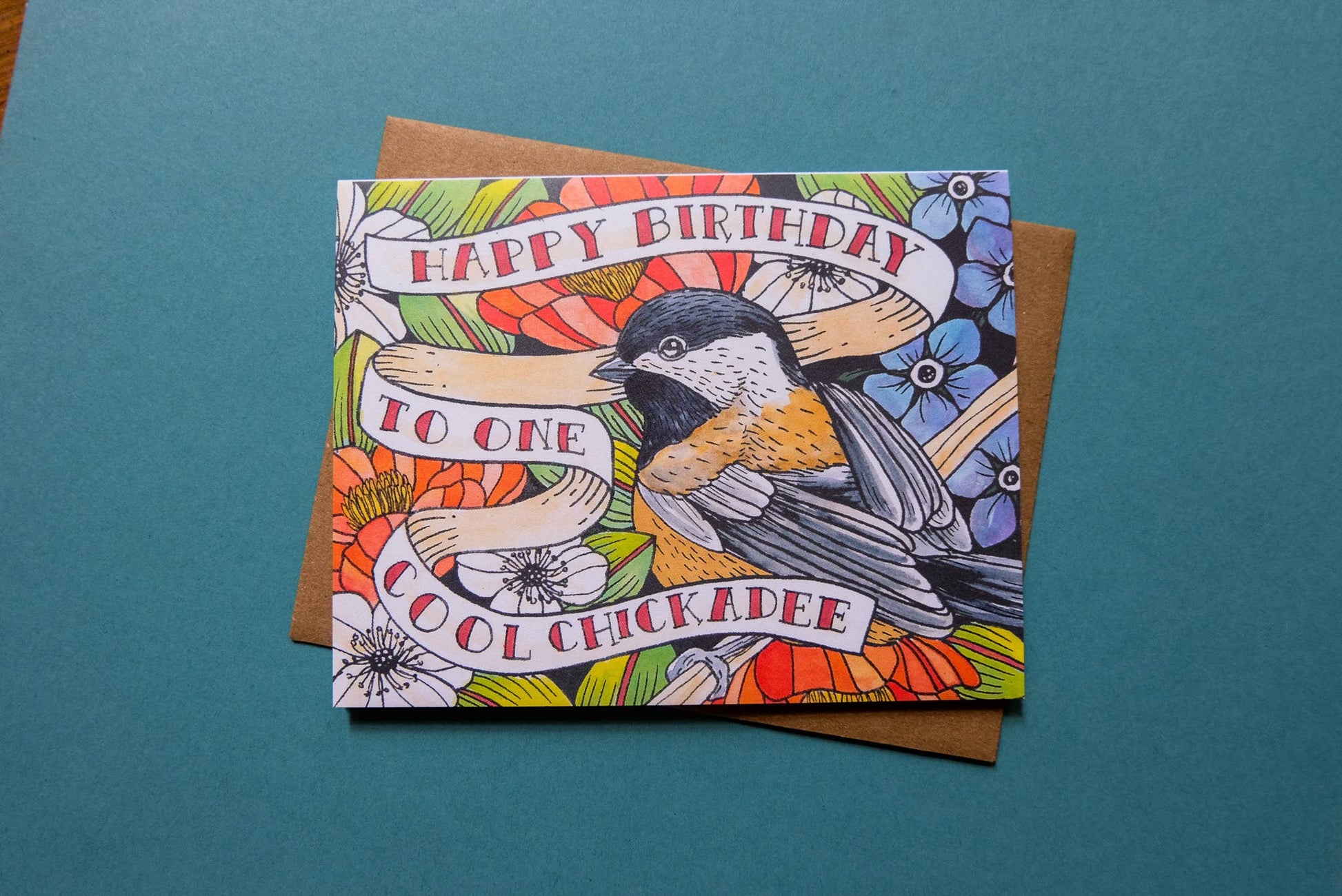 Birthday card with chickadee illustration on a teal background