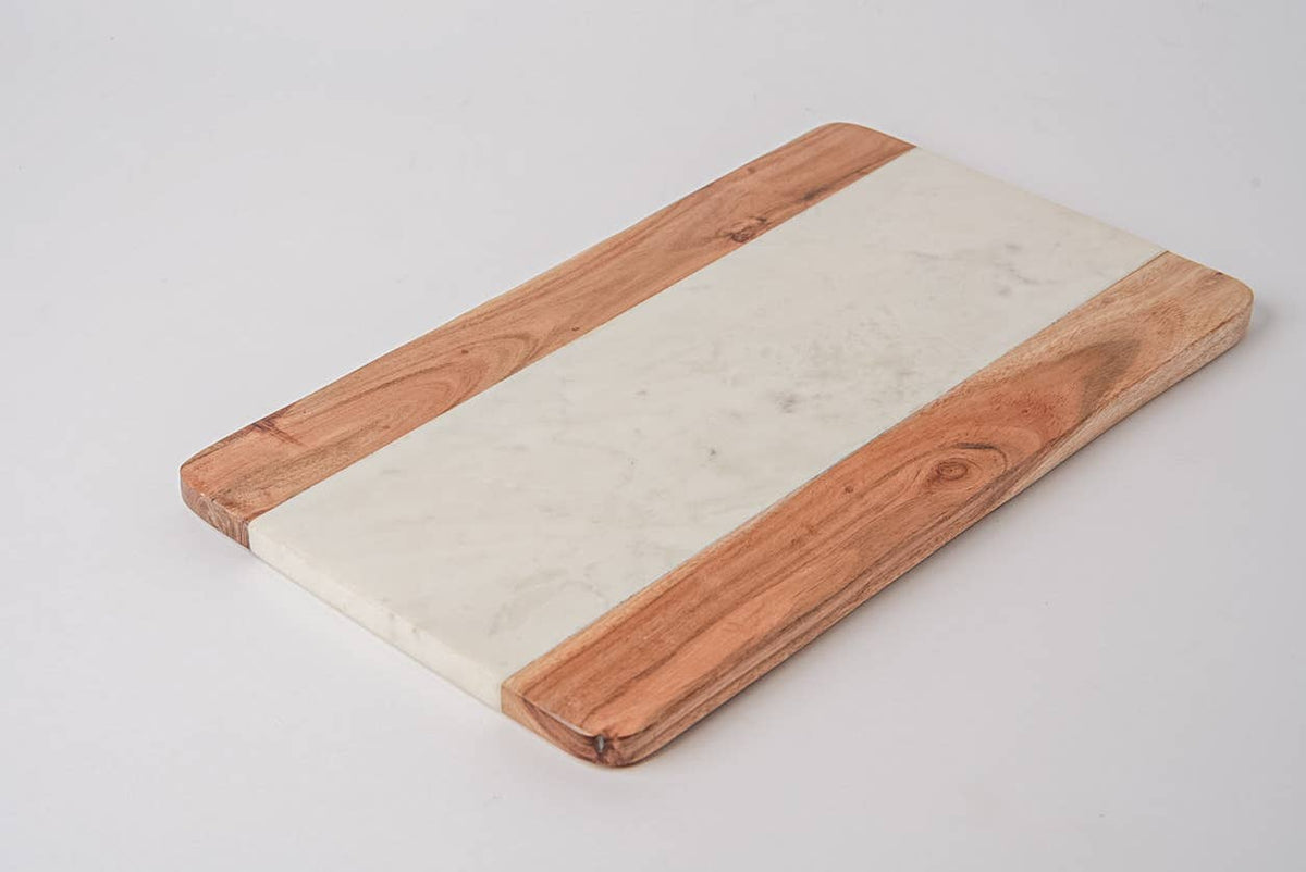 Marble and wood cutting board on a light gray background