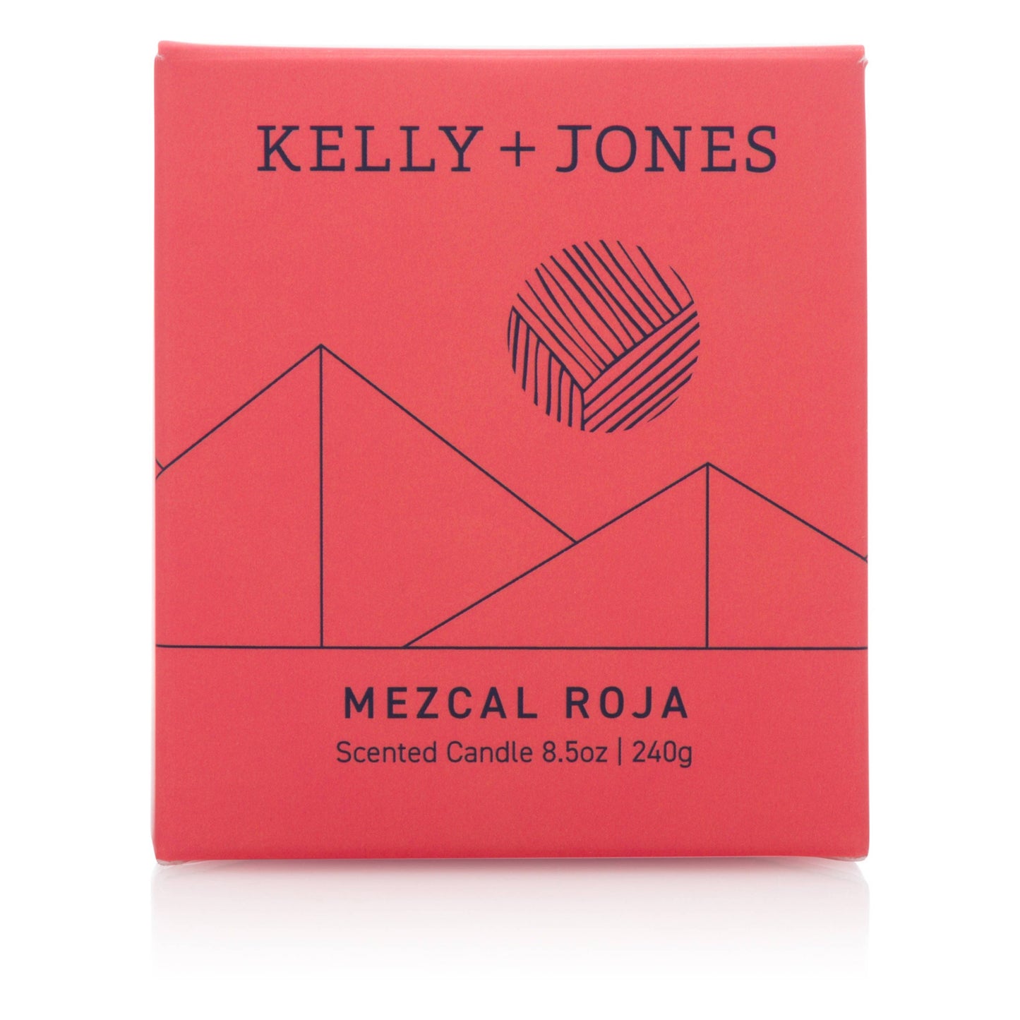 Red packaging of a scented candle by Kelly + Jones with geometric design