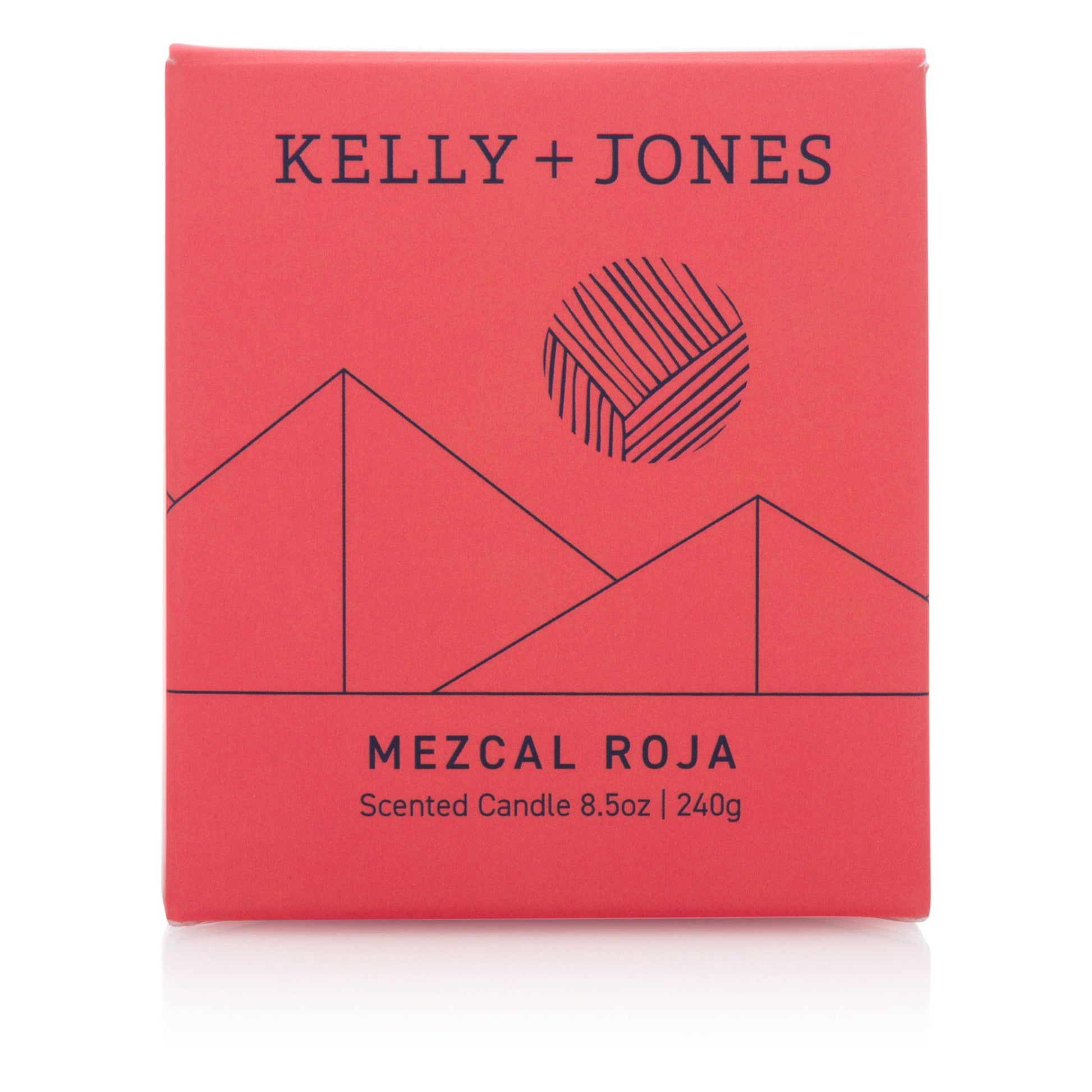 Red packaging of a scented candle by Kelly + Jones with geometric design