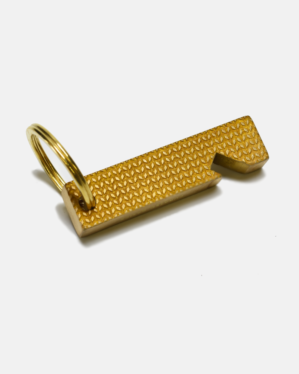 A gold-colored textured metal keychain tool with a split ring, shown on a clean white background.