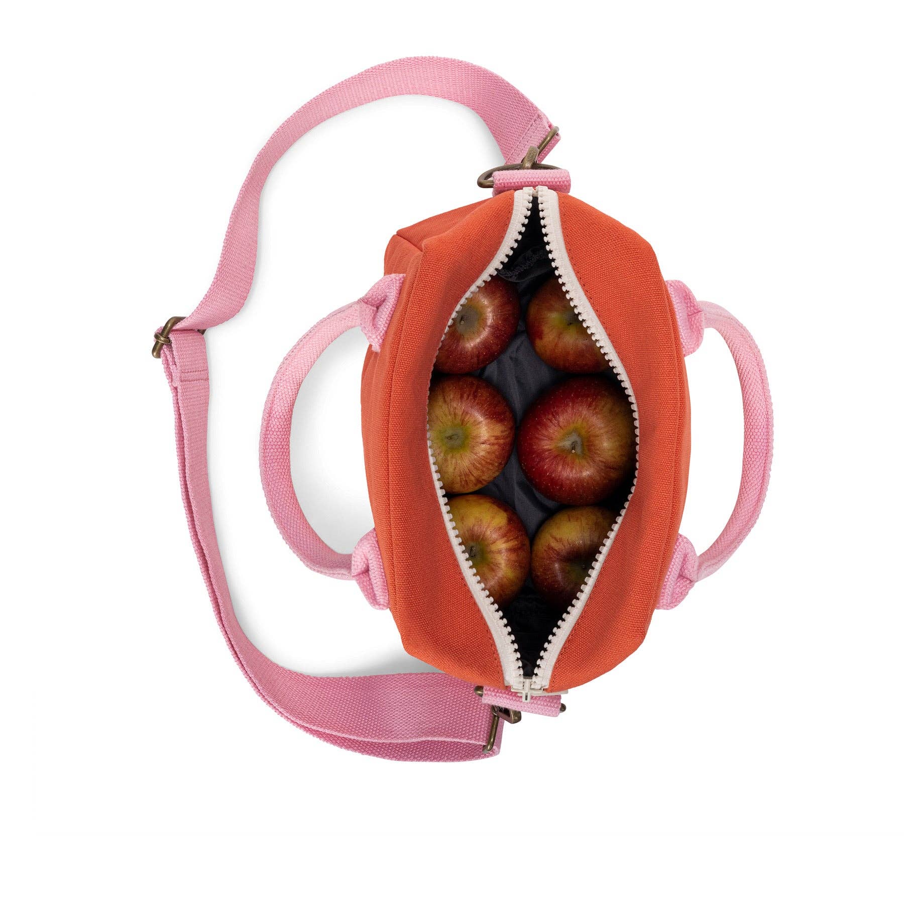 An orange and pink zippered lunch bag shown from above, open to reveal red apples inside, on a white background.