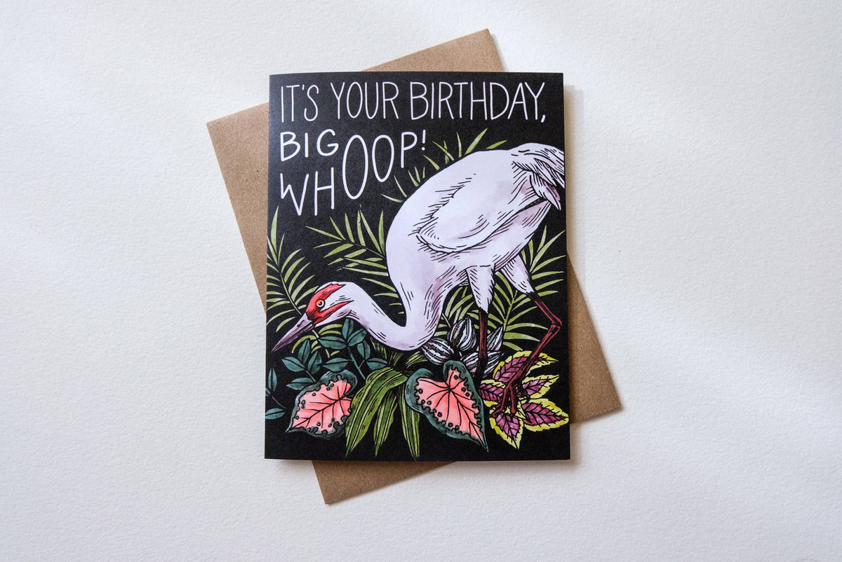 Birthday card with a crane and floral design on a white background