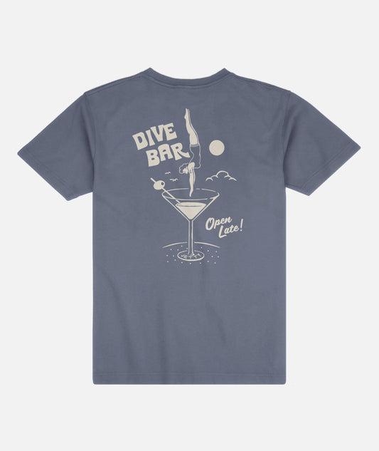 Blue t-shirt with a graphic design of a diving woman into a martini glass on a white background