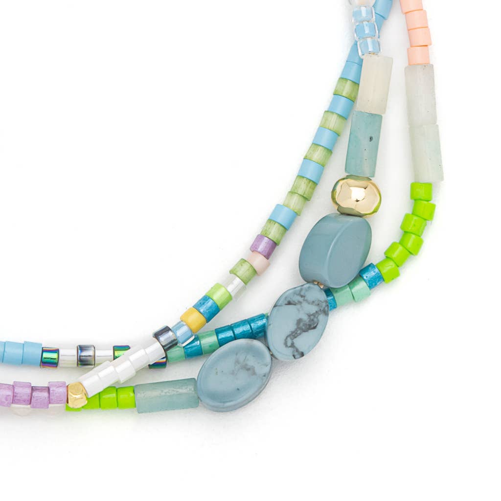 Colorful beaded necklaces on a white background