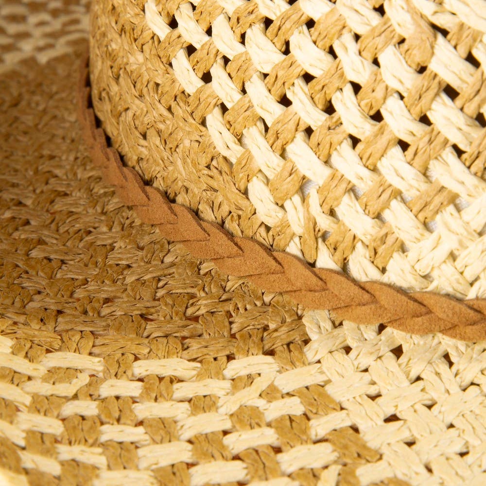 Close-up of woven straw mat with natural brown and beige colors