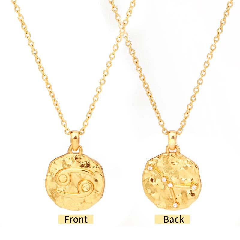 Gold necklace with zodiac symbol pendant on a white background