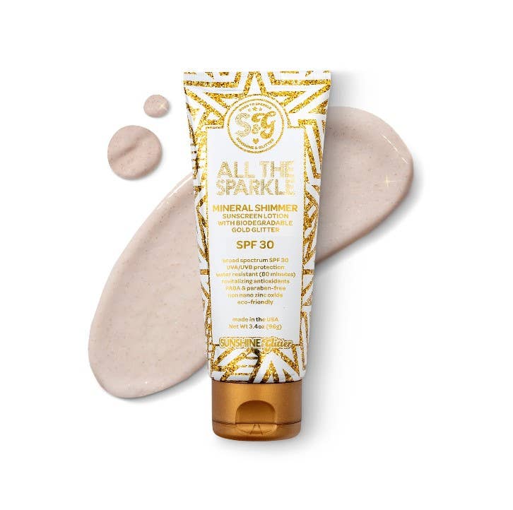 Tube of 'All the Sparkle' sunscreen lotion with gold glitter on a white background