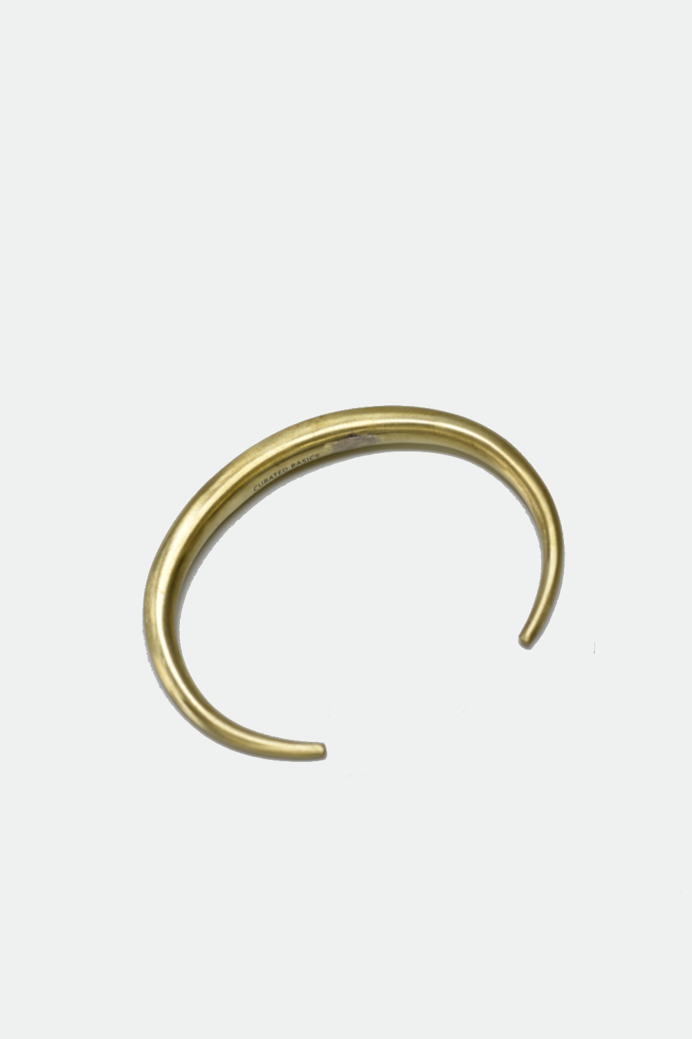 Gold nose ring on a white background