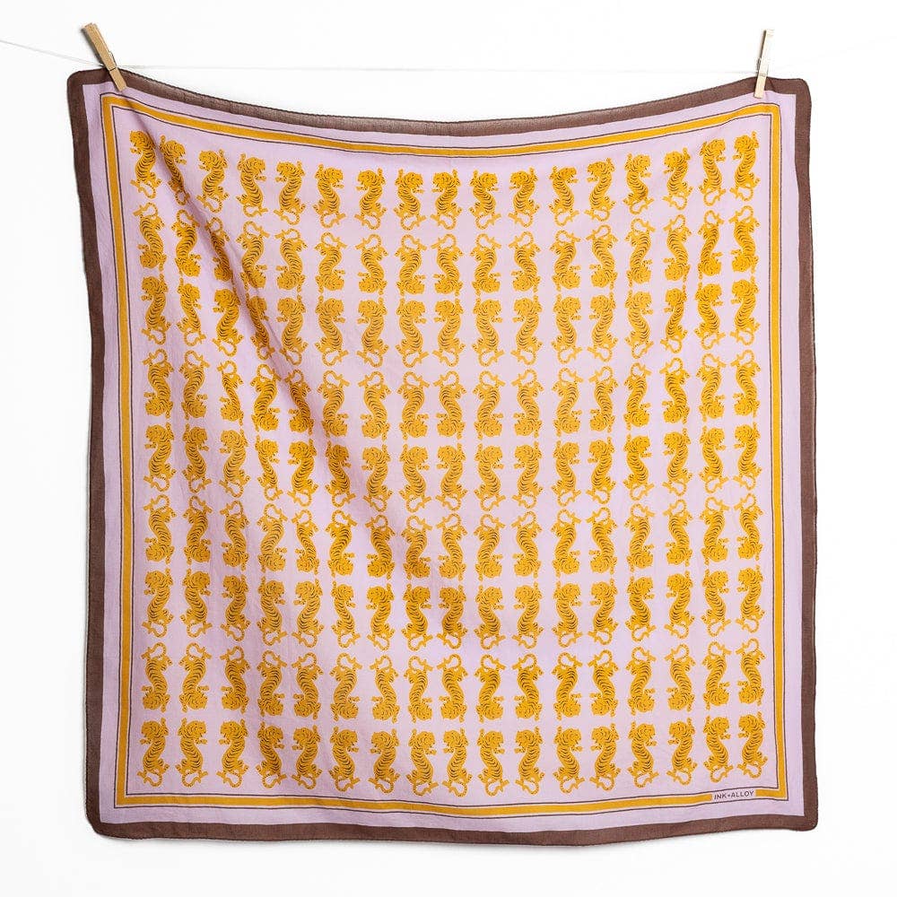 Square scarf with yellow pattern on a white background