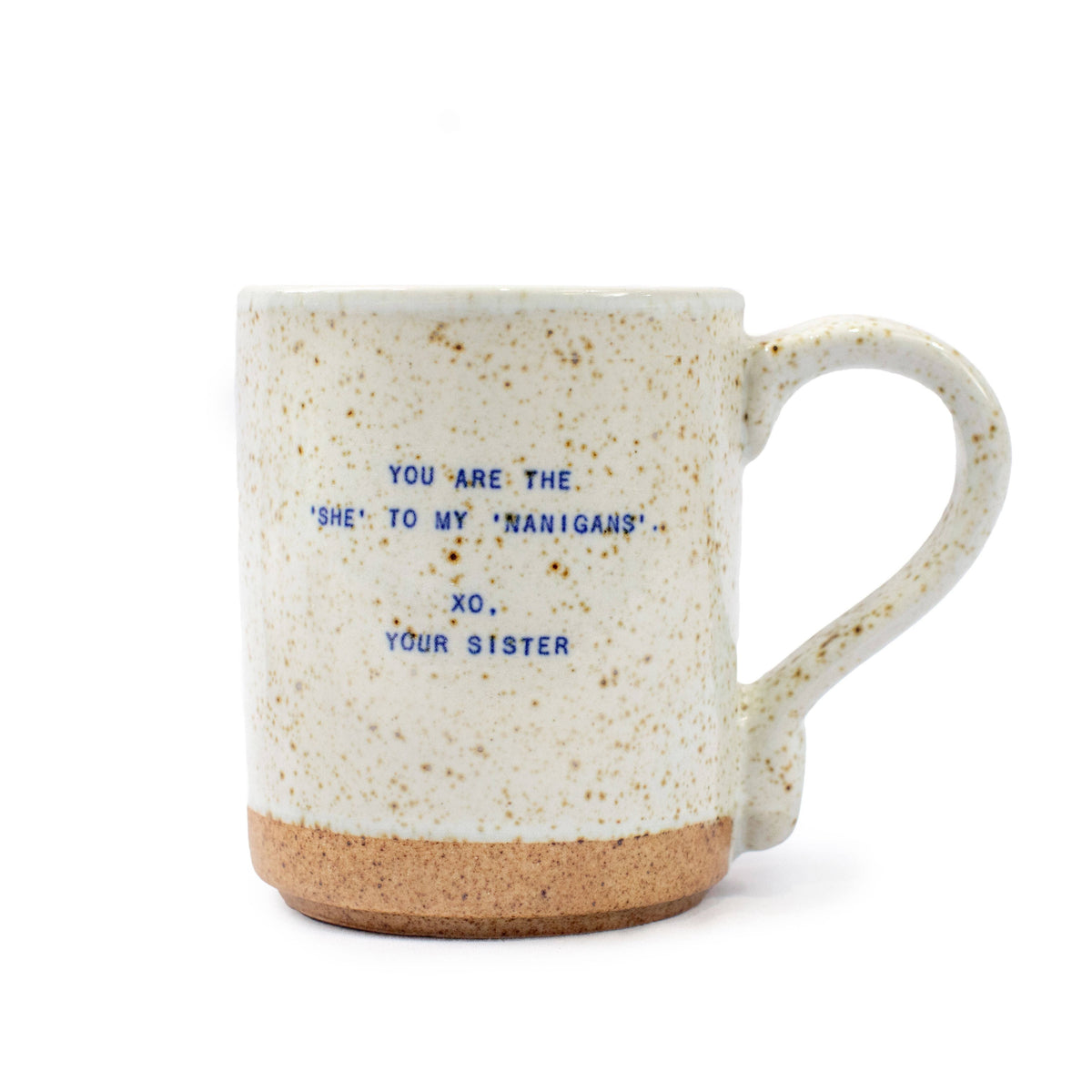 Speckled mug with blue text on a white background