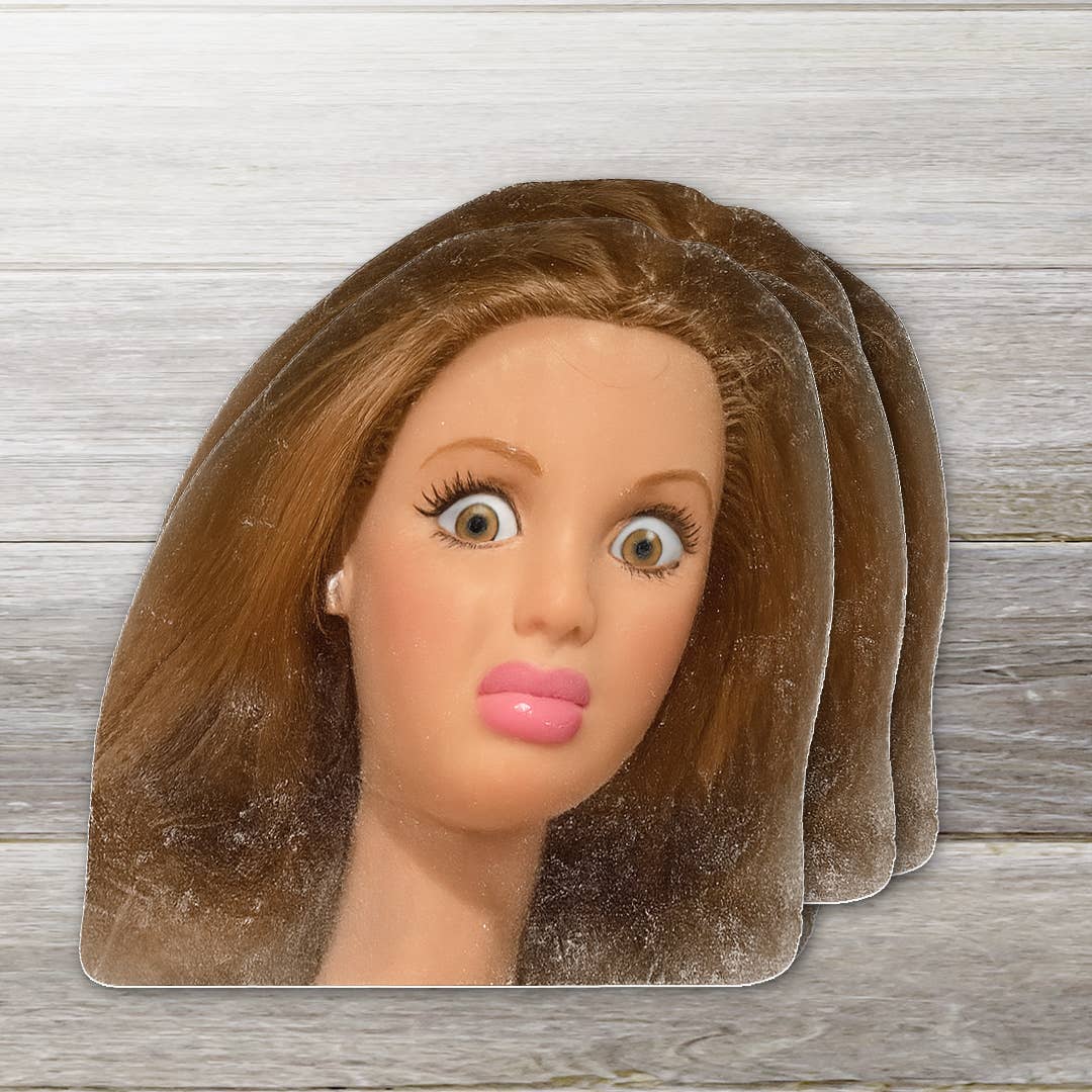 Mannequin head with brown hair on a wooden surface