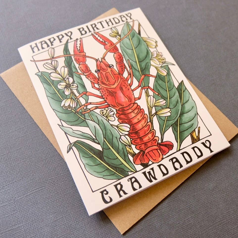 Birthday card with a lobster illustration and 'Happy Birthday Crawdaddy' text on a gray background.