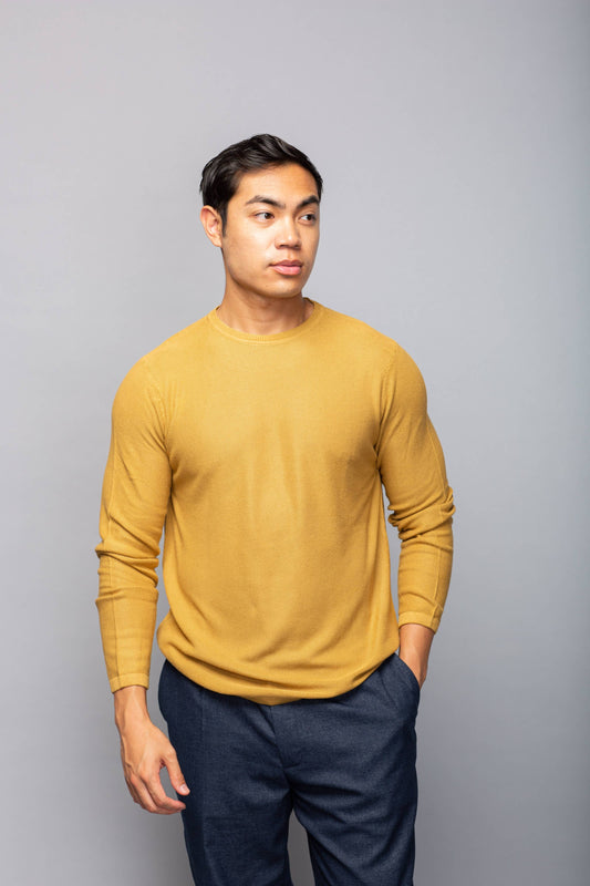 Solid color crewneck pullover made from 100% bamboo-dyed fabric with 12-gauge tuck knit and ribbed neckline and hems.