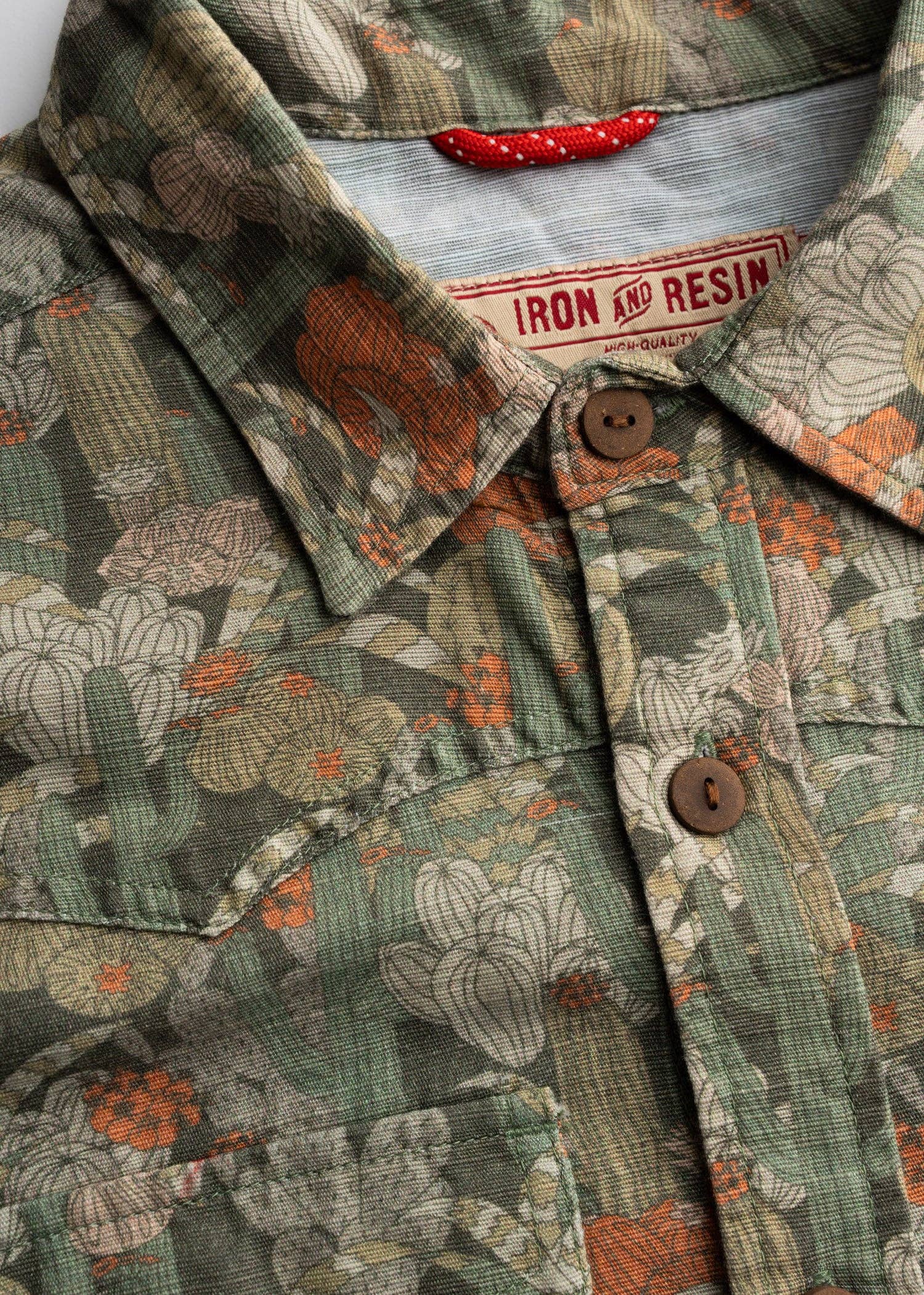 Close-up of a patterned shirt with a brand label visible