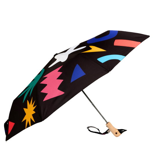Colorful umbrella with abstract patterns on a black background
