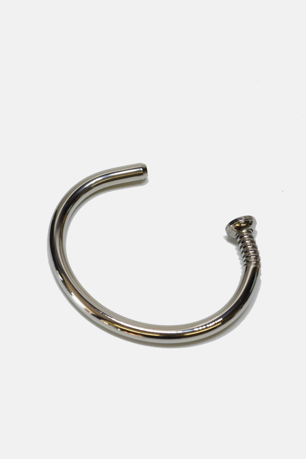 Silver nail cuff on a white background