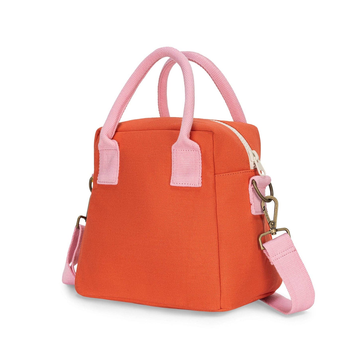 An orange insulated lunch bag with light pink handles, trim, and detachable shoulder strap, shown on a clean white background.