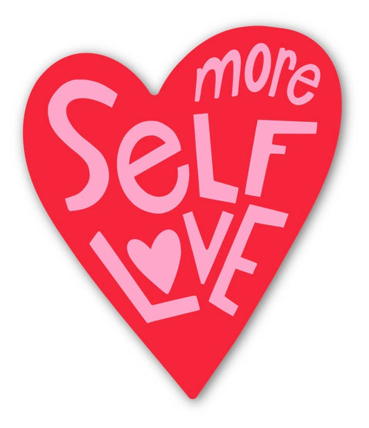Red heart-shaped sign with 'more self love' text in pink on a white background