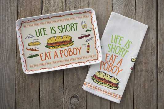 Tray and towel set with 'Life is Short, Eat a Poboy' text on a wooden surface