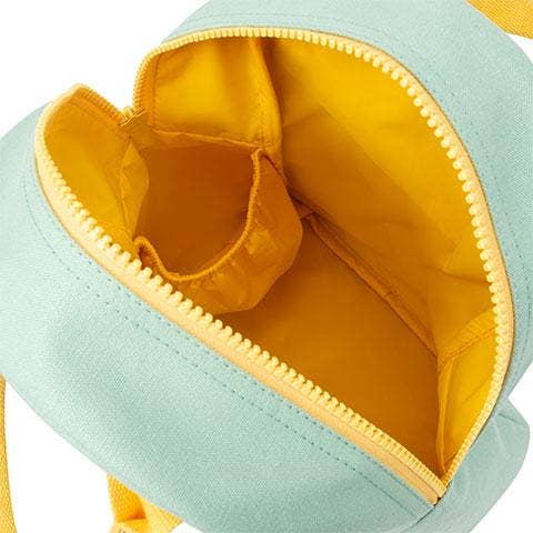 Close-up of a small mint green bag with a bright yellow interior and zipper, showing the inside compartments and fabric texture.