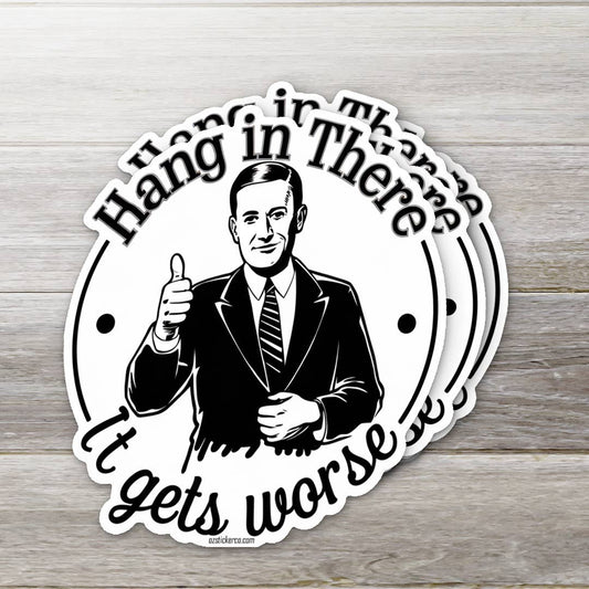 Circular sticker with a man giving a thumbs up and text 'Hang in there, it gets worse' on a wooden background