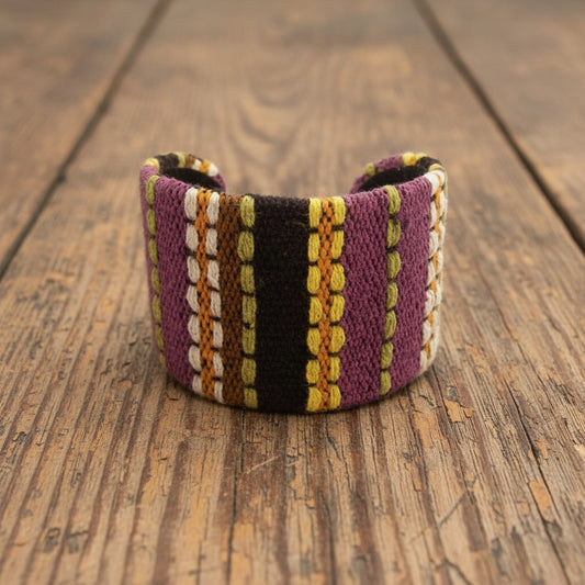 Woven bracelet with multicolor pattern on a white background
