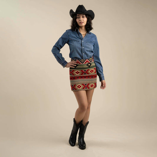 Southwest-style skirt with bold patterns, fitted through the hips, and cut to mid-thigh; perfect for styling with boots or sandals.