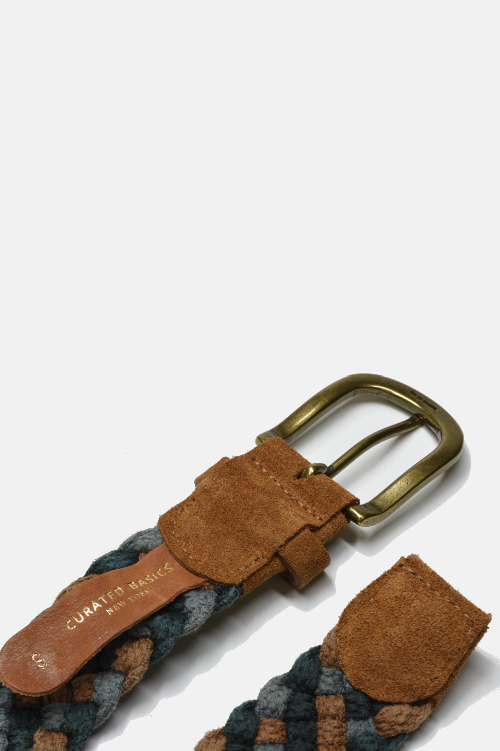 Woven belt with brown leather buckle and tag on a white background