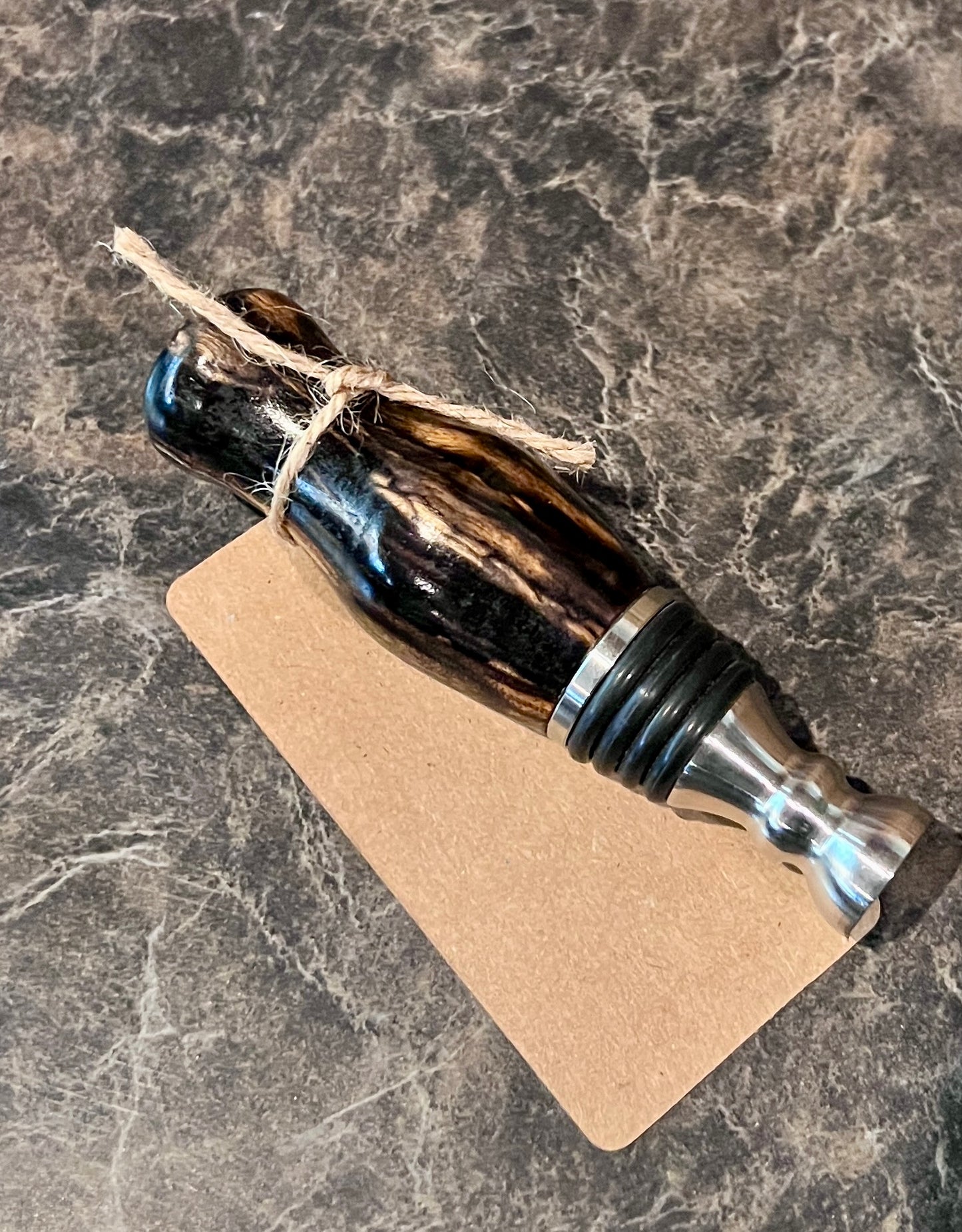 Wooden and metal tool on a marble surface