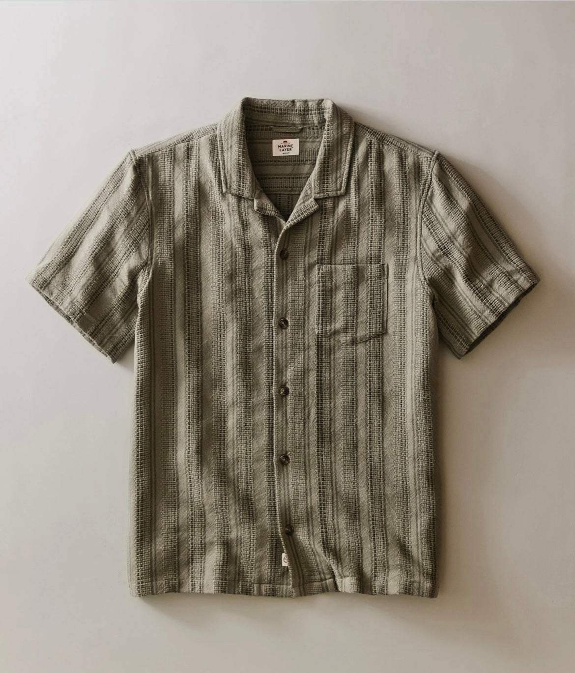Striped short-sleeve shirt on a light background