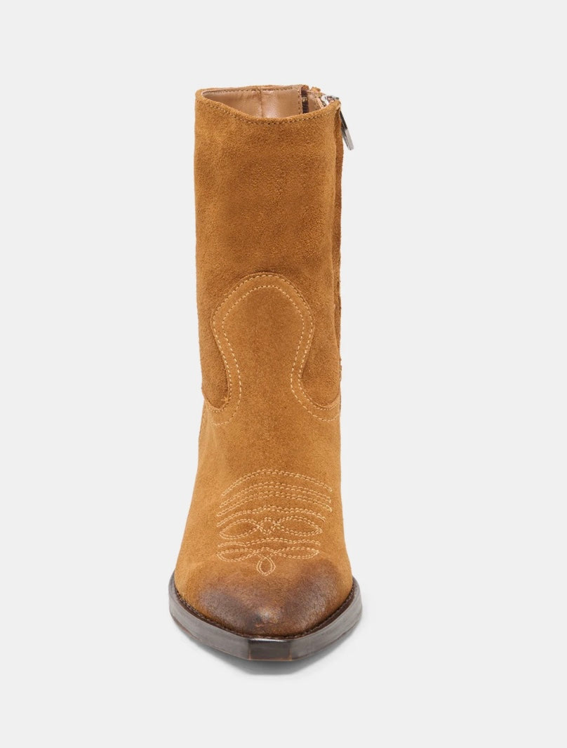 Tan suede boot with decorative stitching on a white background