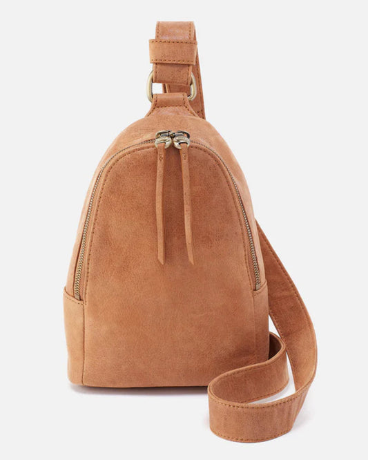 Brown suede sling bag on a white background