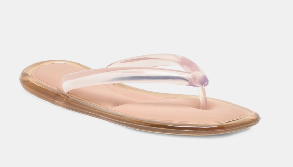 Beige sandal with a clear strap on a light gray background