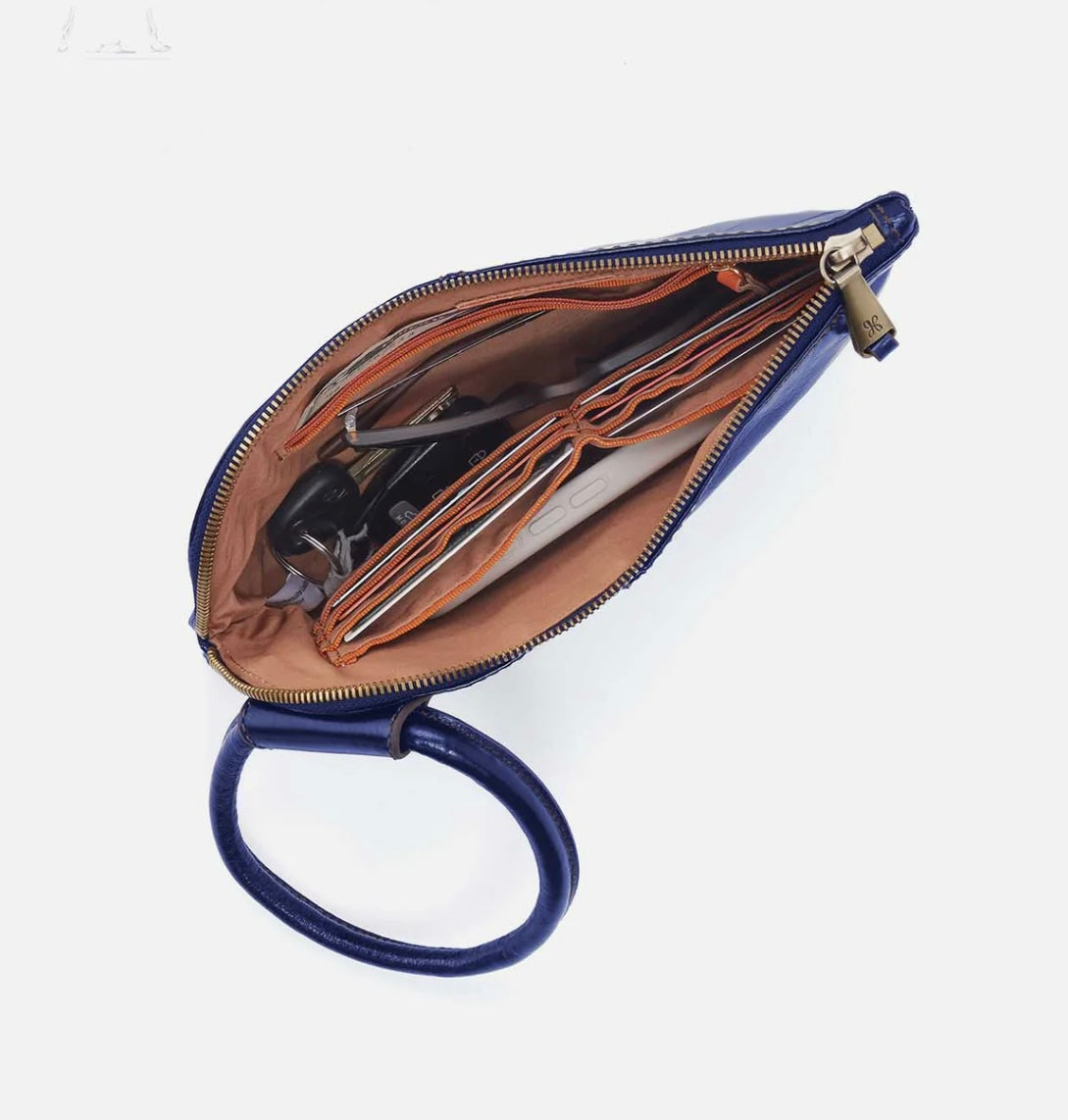 Blue handbag with open interior on a white background