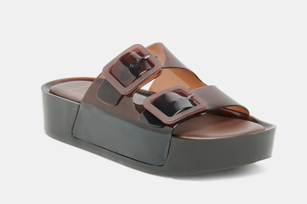Brown sandal with two buckles on a light gray background